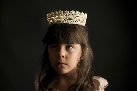 Girl wearing crown and princess costume