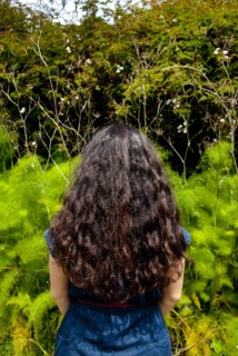 Iranian woman standing in garden