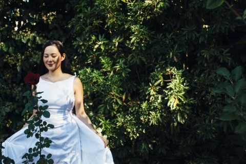 Korean bride wearing wedding dress in garden