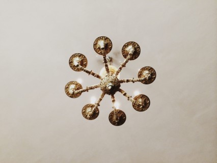 Low angle view of chandelier hanging from ceiling