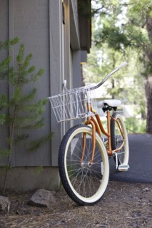 Bicycle leaning on corner of house