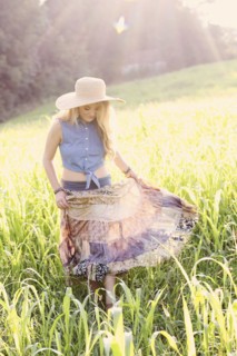 Teenage girl walking in tall grass