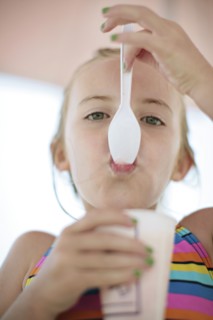 Close up of Caucasian girl eating ice cream