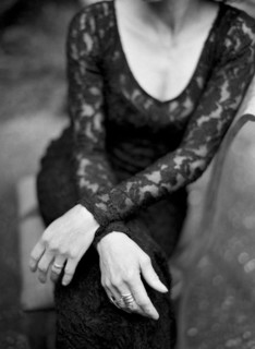 Close up of woman sitting in backyard