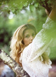 Close up of woman climbing tree