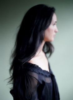 Close up of woman with long hair and lace blouse