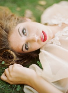 Close up of woman laying in grass