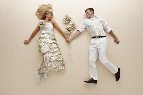 Caucasian couple with flowers laying on floor