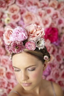 Smiling woman wearing flowers in her hair