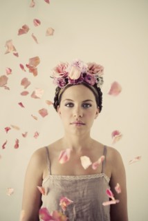 Serious woman wearing flowers in her hair