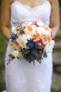 Close up of bride holding bouquet of flowers
