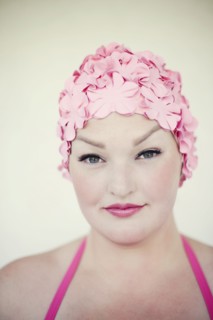 Woman wearing swim cap and bathing suit