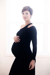 Pregnant woman wearing evening gown