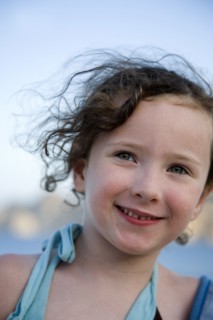 Close up of Caucasian girl smiling outdoors