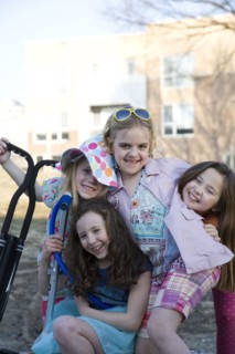 Smiling girls playing in park