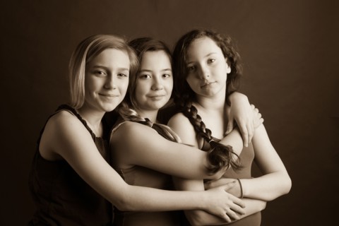 Smiling sisters hugging