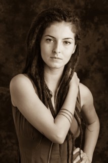 Close up of serious woman with dreadlocks