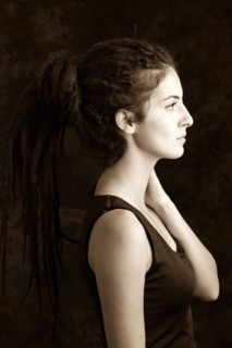 Close up profile of serious woman with dreadlocks