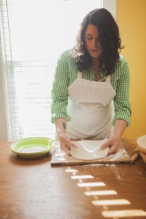 Baker rolling dough on counter