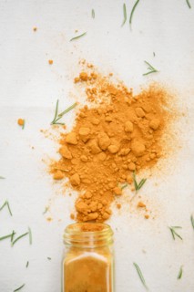 Jar of spilled spices and herbs