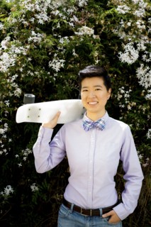 Androgynous woman holding skateboard