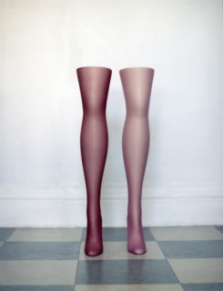 Mannequin legs standing on tiled floor