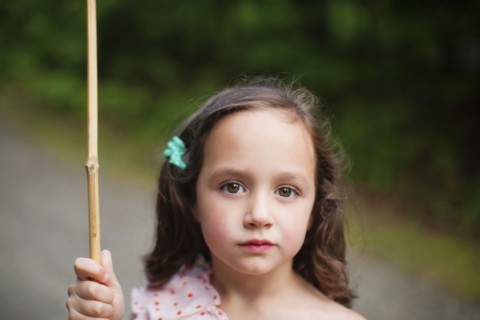 Caucasian girl holding butterfly net