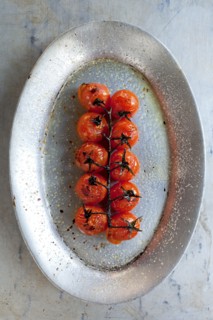 Plate of roast cherry tomatoes on vine