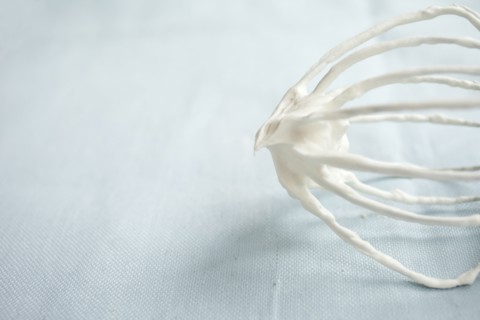 Close up of whipped cream on whisk