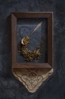 Herbs and spoon in picture frame