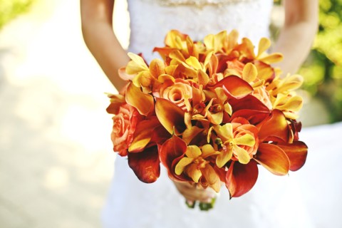 Bride carrying bouquet of flowers