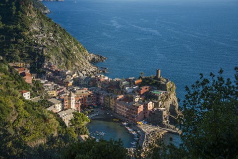 Aerial view of Cinque Terre cityscape and ocean cliffs