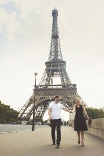 Caucasian couple walking near Eiffel Tower