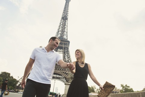 Caucasian couple walking near Eiffel Tower
