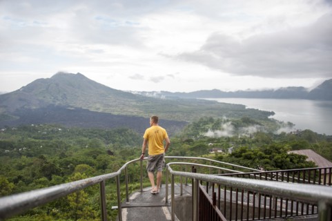 Caucasian tourist admiring scenic view of jungle