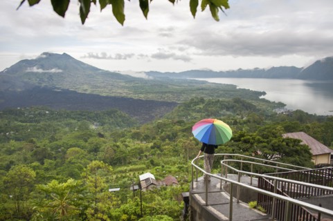 Caucasian tourist admiring scenic view of jungle