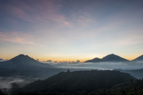 Hilltops over morning fog in remote landscape