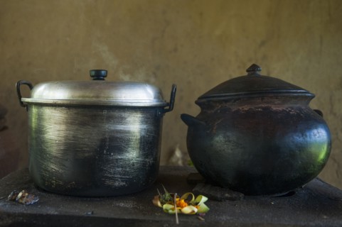 Close up of iron and steel pots on kitchen counter