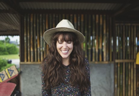 Smiling Caucasian woman wearing sun hat outdoors