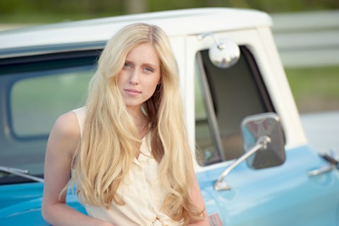 Caucasian woman standing near truck