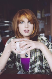 Caucasian woman drinking coffee in cafe