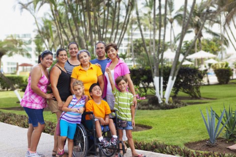 Hispanic family standing together outdoors