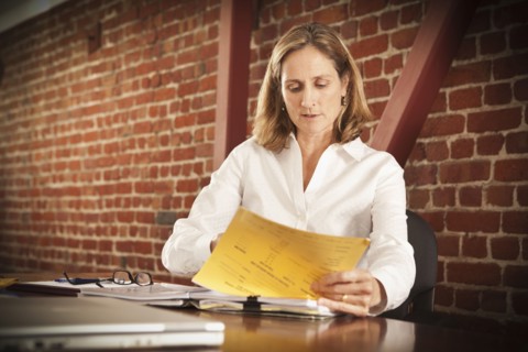 Caucasian businesswoman working in office