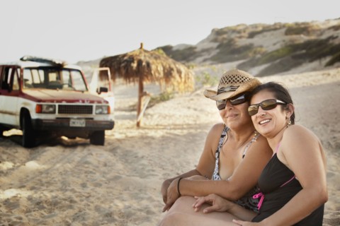 Hispanic women enjoying the beach