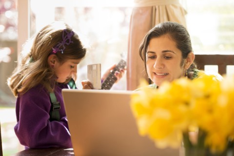 Mother shopping online with daughter