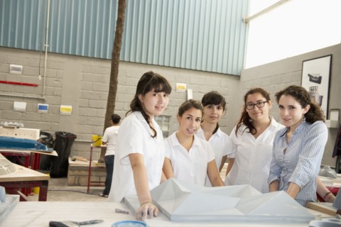 Workers talking in manufacturing plant