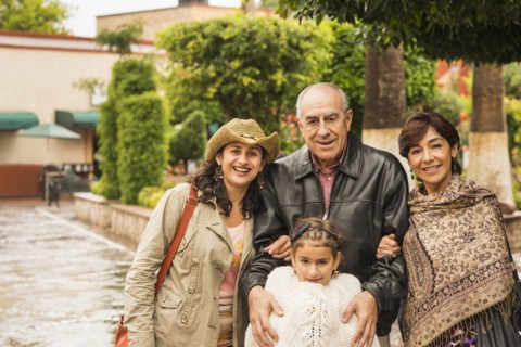 Family smiling together outdoors