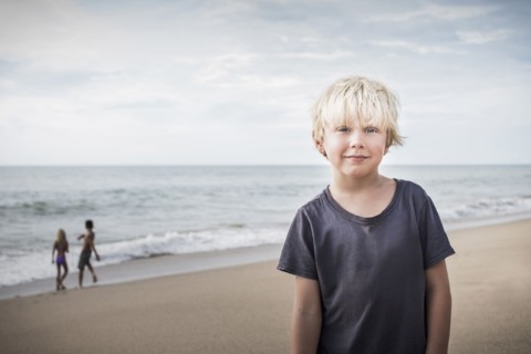 Boy smiling on beach