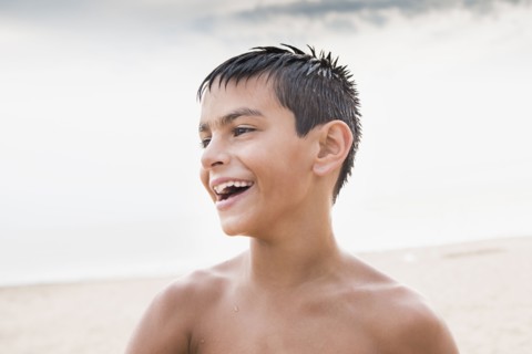 Mixed race boy smiling outdoors