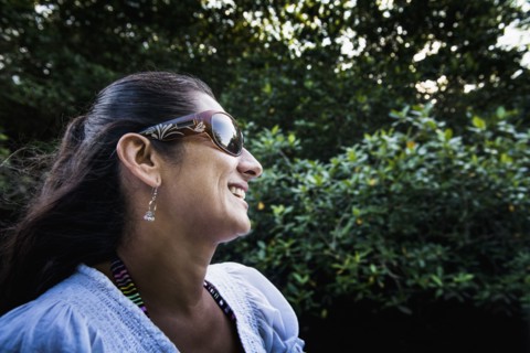 Hispanic woman smiling outdoors